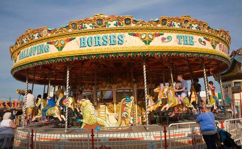 Galloping Horse traditional fairground carousel ride, Great Yarmouth, Norfolk, England, United