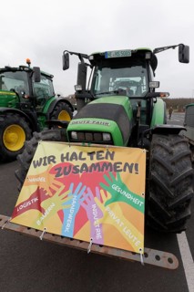 We stick together, sign on a tractor, farmers' protests, demonstration against policies of the