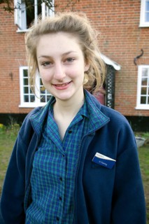 Model released teenage girl in uniform for her job in a Co-operative shop, UK