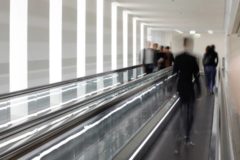 Members of the German Bundestag run across a treadmill between the Reichstag and Paul Loebe Haus,