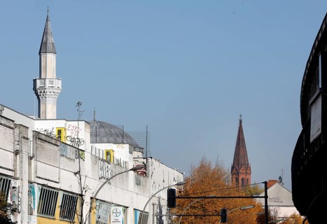 A church tower and the minaret of the Mevlana mosque in Berlin's Kreuzberg district, 12 October