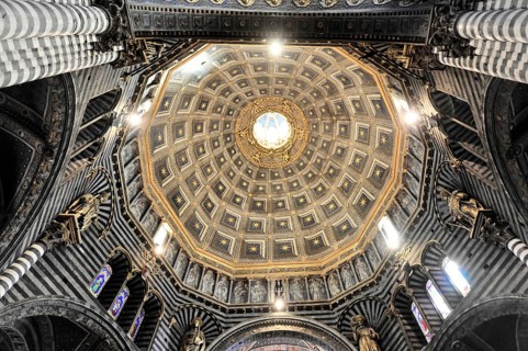 The dome of the cathedral with starry sky and black and white striped marble columns and round