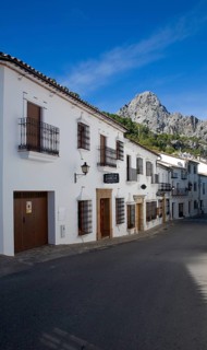 Limestone mountain peaks tower over the Village of Grazalema, Cadiz province, Spain, Europe