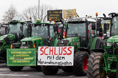 Stop the regulation madness, sign against bureaucracy on a tractor, farmers' protests,