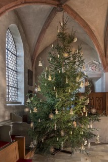 Christmas tree decorated with straw stars in St Egidienkirche, Beerbach, Middle Franconia, Bavaria,