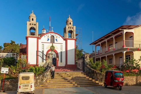 Motorbike taxi in front of the Inglesia Ave Maria church, Pluma Hidalgo, Pochutla, Oxaca state,