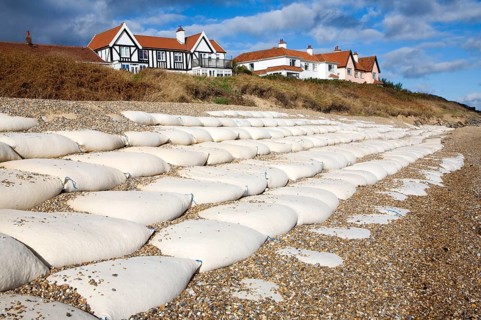 Coastal defences normally covered by shingle exposed by winter storms at Thorpeness, Suffolk,
