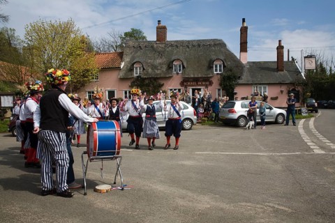 Traditional Morris Men doing country dancing in the village of Shottisham, Suffolk, England, United