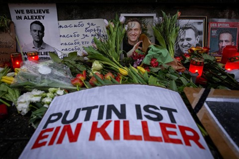 Photos, candles, grave lights and flowers for the Russian opposition leader Alexei Navalny, who