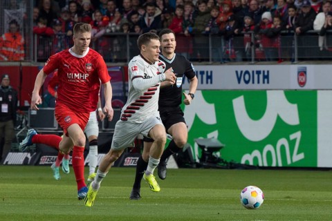 Football match, Florian WIRTZ Bayer Leverkusen right at the ball is followed by Jan SCHOePPNER 1.FC