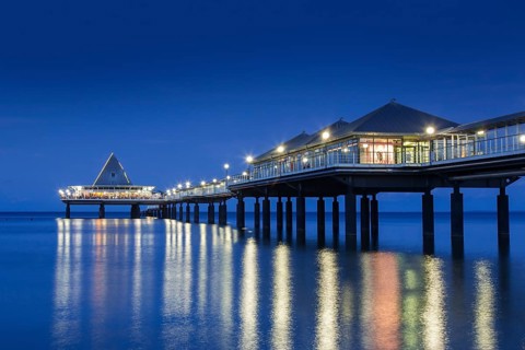 Heringsdorf Pier, Seebruecke Heringsdorf illuminated at night in the Baltic Sea on the island of
