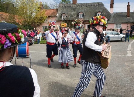 Traditional Morris Men doing country dancing in the village of Shottisham, Suffolk, England, United