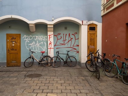 Bicycles leaning against a house wall, graffiti, Graz, Styria, Austria, Europe