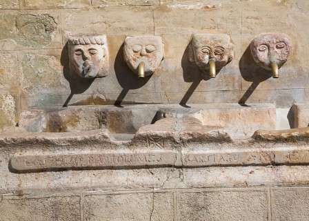 Stone water fountain faces village of Grazalema, Cadiz province, Spain, Europe