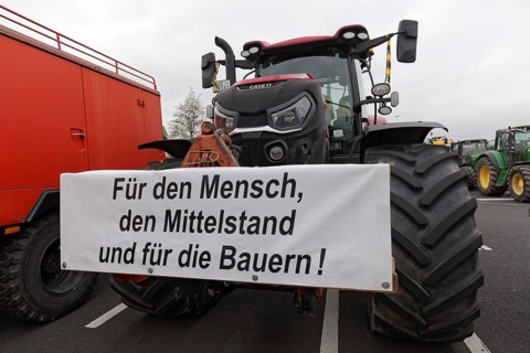 For the middle class, sign on a tractor, farmers' protests, demonstration against policies of the