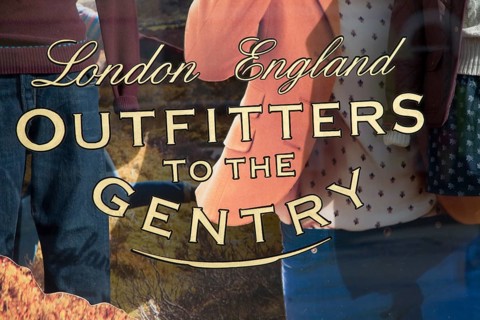 Outfitters to the Gentry shop window sign for an expensive men's clothing shop, Aldeburgh, Suffolk,