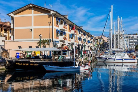 Fishing boats in the harbour, island of the lagoon town of Grado, north coast of the Adriatic Sea,