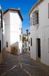 Historic street cobbled street architecture in old city Ronda, Spain, Europe