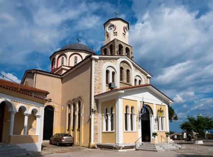 Orthodox church with a prominent bell tower surrounded by cobbled streets, Holy Church of the