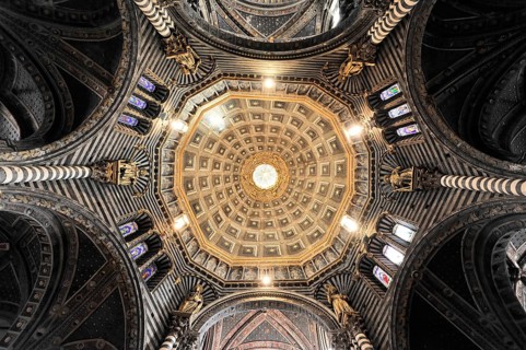 The dome of the cathedral with starry sky and black and white striped marble columns and round