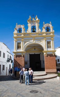 Men gather by the baroque church of San Juan at Zahara de la Sierra, Spain Sunday 13 October 2013