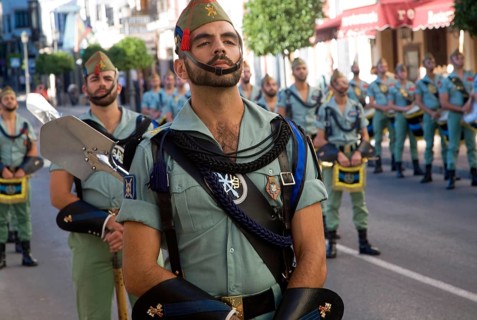 Military band parade of soldiers marching for National day celebrations in Ronda, Spain, Europe