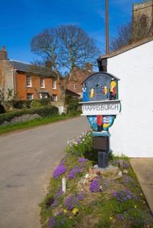 Village sign and houses, Happisburgh, Norfolk, England, United Kingdom, Europe