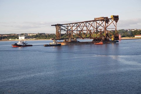 Large North Sea oil drilling platform leaving the River Tyne, Tynemouth, Northumberland, England,