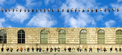People sitting in the sun on an otherwise cool day, Max-Joseph-Platz, Munich, Bavaria, Germany and