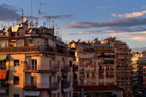 Residential buildings, roof antennas, Leonida Iasonidou street, evening light, Thessaloniki,