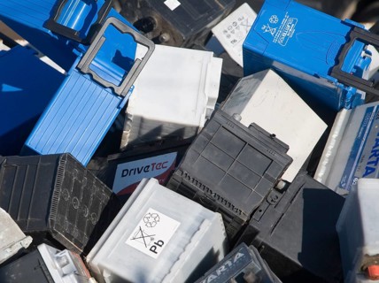 Car batteries in skip for recycling