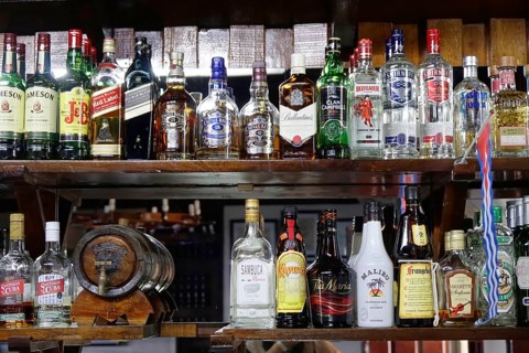 Rum bottles, liqueur bottles, restaurant near Santa Clara, Cuba, Greater Antilles, Caribbean,