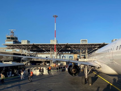 Passengers boarding the aircraft from the shuttle bus, Aegan Airlines, tarmac, Makedonia Airport,