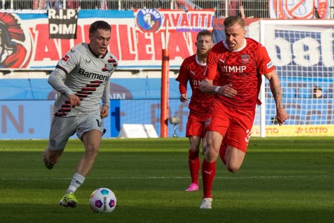 Football match, Florian WIRTZ Bayer Leverkusen left on the ball in a duel with Lennard MALONEY 1.FC