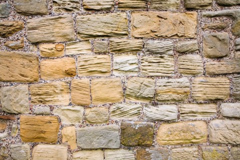 Grooves cut in sandstone blocks by wind erosion at Tynemouth priory, Northumberland, England,