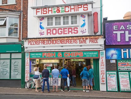 Rogers famous fish and chips shop with queue of people, Great Yarmouth, Norfolk, England, United