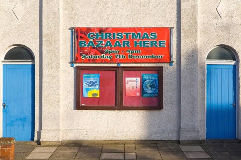 Christmas Bazaar event notice on church hall at Walton, Felixstowe, Suffolk, England, United