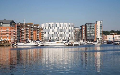 Modern university building at centre of waterfront urban redevelopment, Wet Dock, Ipswich, Suffolk,
