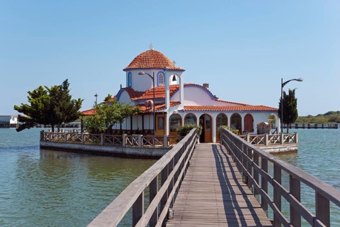 Small church on the waterfront connected by a wooden bridge, Monastery of St Nicholas, Monastery of