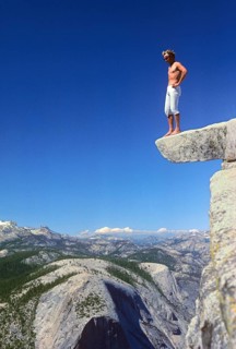 Man standing on top of Half Dome, Yosemite Valley National Park, California, USA, vintage, retro,
