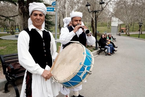 Musicians in traditional dress play music in a park in Tehran, Iran, woman, 14.03.2019, Asia