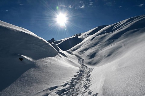 Snowshoe hiking in the Beverin nature park Park, Graubuenden, Switzerland, Europe