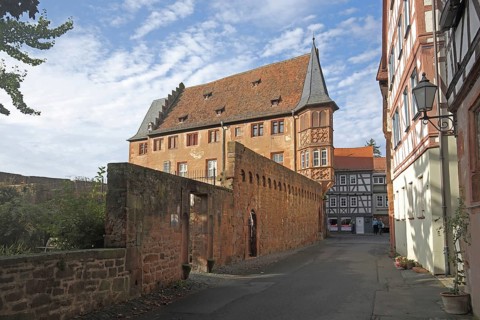 Stone house built in 1510 and historic town fortifications, Buedingen, Wetterau, Hesse, Germany,