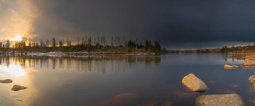 View over the Harz Oderteich in winter, dam, sunset, panorama, landscape format, evening light,