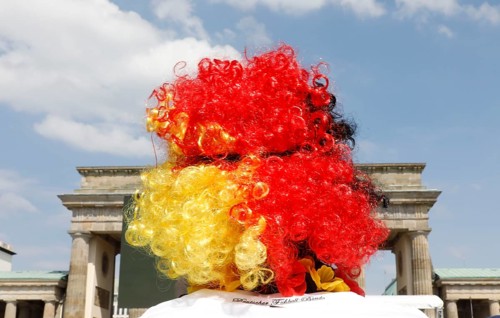 Football fan wears a wig with the colours of the German flag for the World Cup opening match