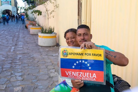 Oaxaca, Mexico, A man and a woman trying to make their way from Venezuela to the United States hold