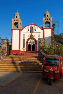 Motorbike taxi in front of the Inglesia Ave Maria church, Pluma Hidalgo, Pochutla, Oxaca state,
