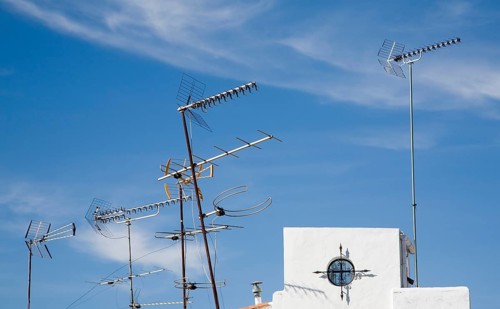 Confused mrs of TV aerials on rooftop in Ronda, Spain, Europe