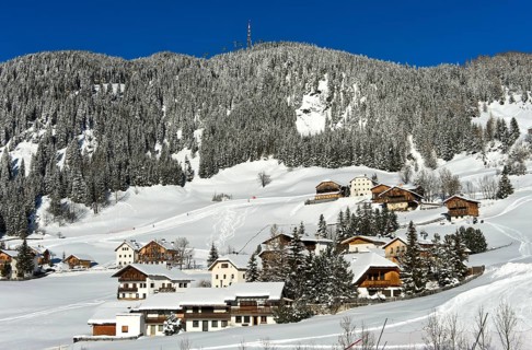 The mountain village of Corvara, Kurfar, at the foot of the Col Alto high plateau in winter, Alta