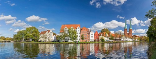 Historic houses and Luebeck Cathedral, Dom zu Luebeck, Luebecker Dom along the river Trave in the